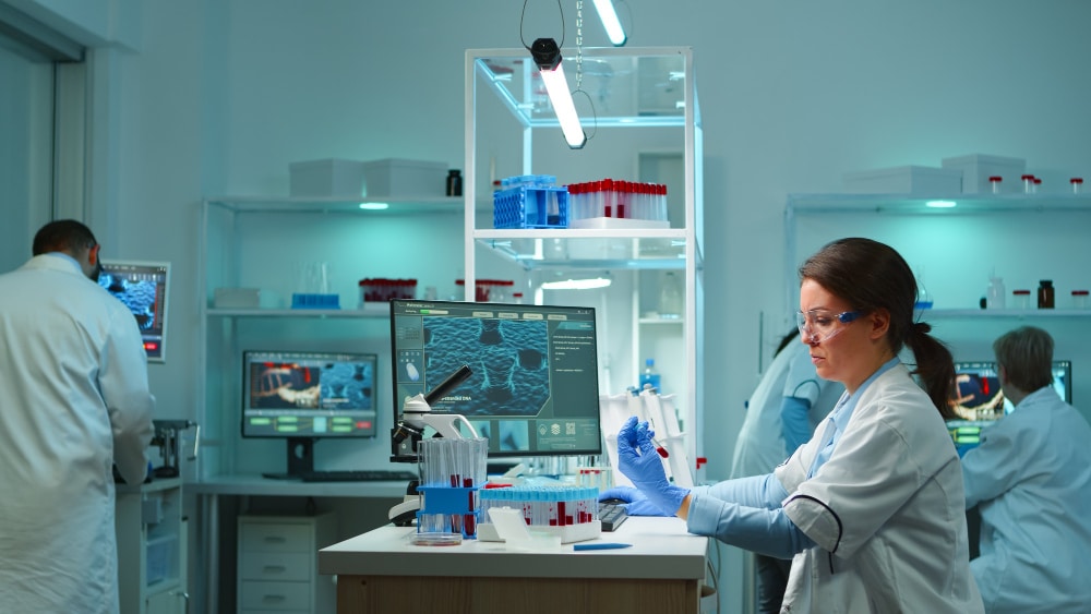Researchers working in a modern laboratory developing CAR T cell therapy and improving biomanufacturing processes for cancer immunotherapy in Canada.
