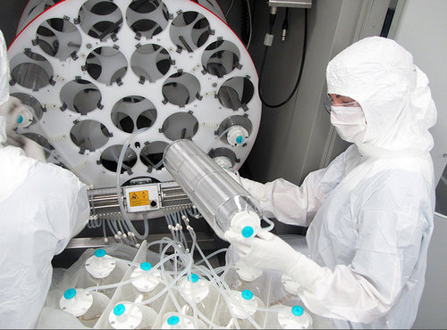 OVMF staff prep the bioreactor to manufacture one of the high-grade, cancer-killing viruses that are produced at the facility for use in clinical trials.