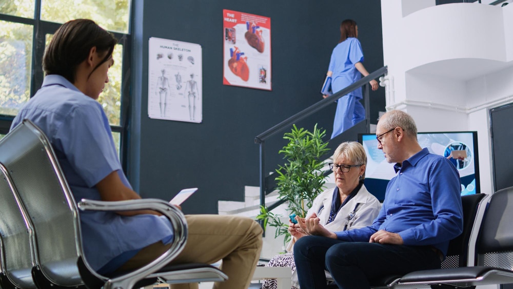 Doctors and researchers meeting in a healthcare setting to discuss clinical translation and translational research initiatives advancing cancer immunotherapy in Canada.