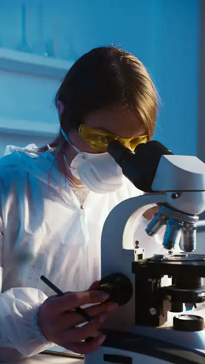scientist_looking_at_microscope